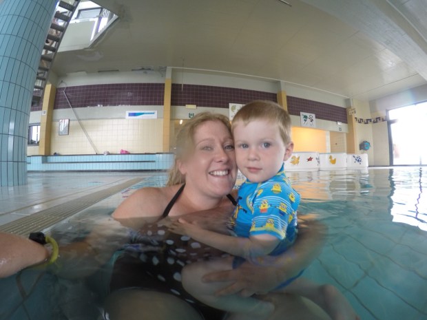 Kathleen and Casey in the swimming pool on a rainy day